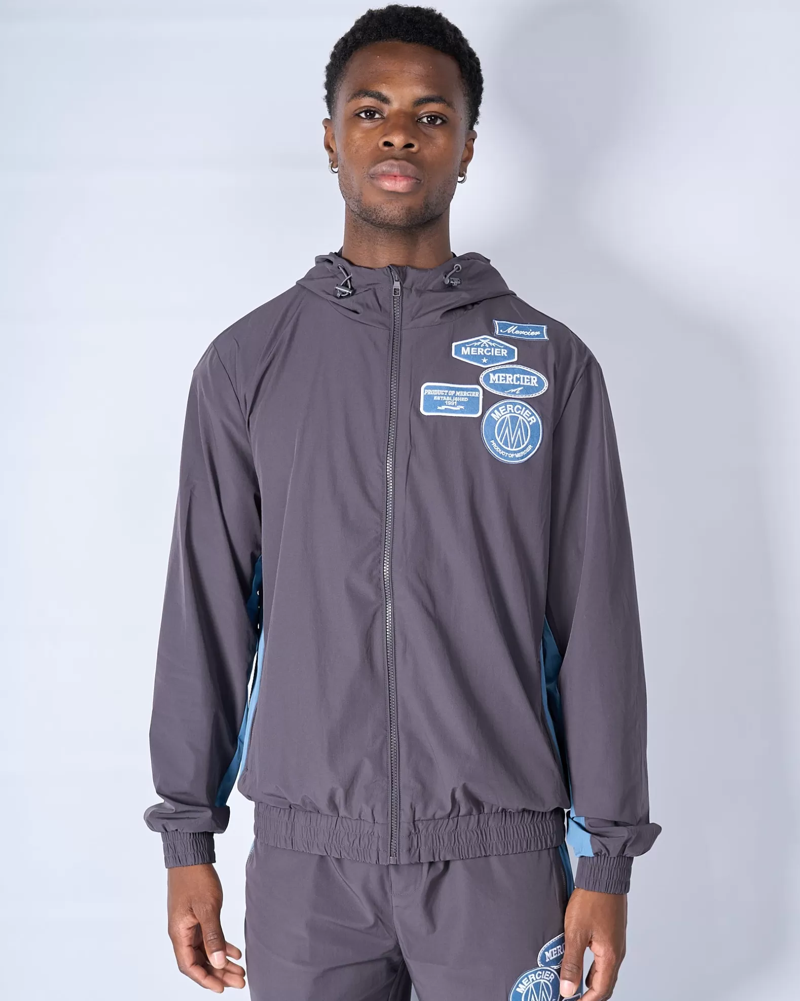 Shop Mercier Slate Flint Contrast Badge Windbreaker